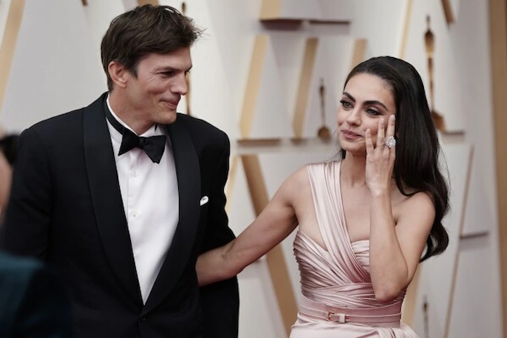 Ashton Kutcher in smiling at a tech event, blending Hollywood charm with Silicon Valley success