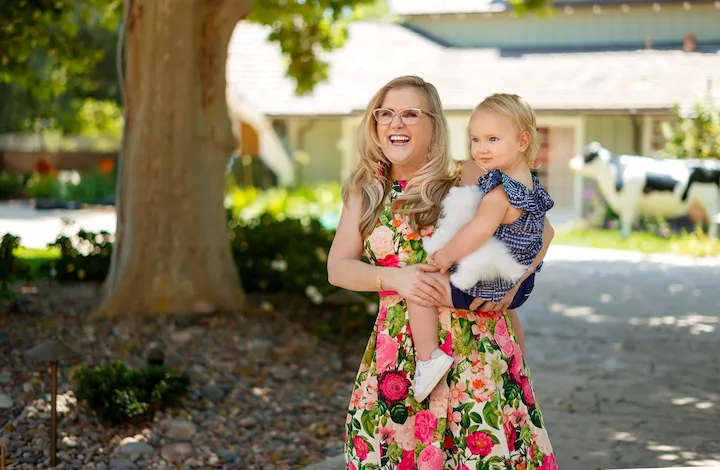 Nancy Cartwright, voice of Bart Simpson, smiling with animated backdrop, representing her career and net worth in 2025.