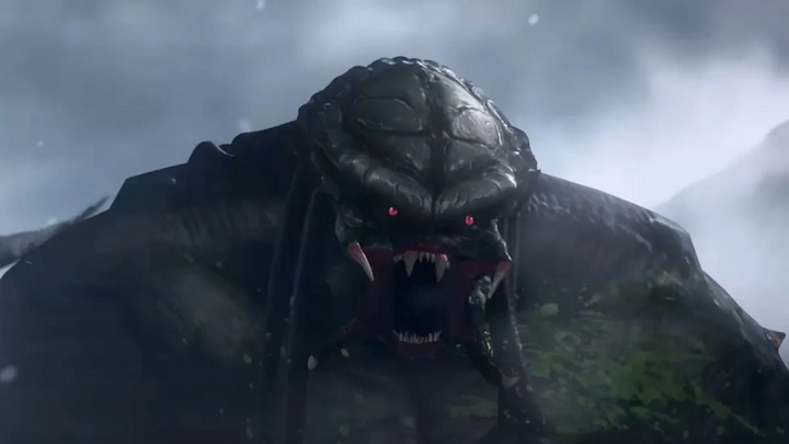 Close-up of a snarling Predator emerging from snowy mist, teeth bared and red eyes glowing in animation.