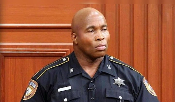 Renard Spivey in sheriff’s uniform on a courtroom TV set during his role on Justice For All