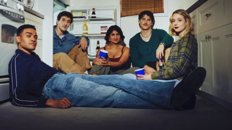 Cast of FX’s Adults sitcom sitting on the kitchen floor holding red and blue solo cups.