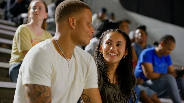 Jay Woods and Grace Clark sharing a smile during a one-on-one conversation on Farmer Wants a Wife.