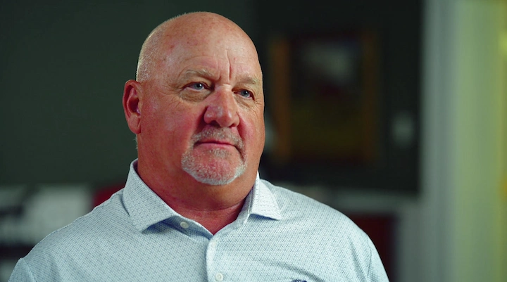 Kenneth McPeek in a light blue shirt, close-up portrait of the famous American horse trainer, 2025