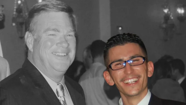 Matt Garcia smiling at a formal event, dressed in a suit..