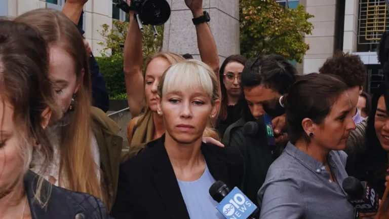 Sherri Papini outside a courthouse, surrounded by reporters and cameras.