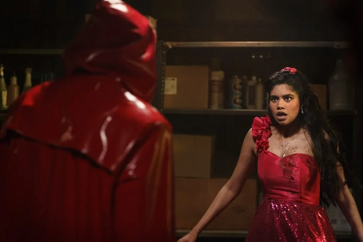 Masked killer stalking a hallway in Fear Street: Prom Queen