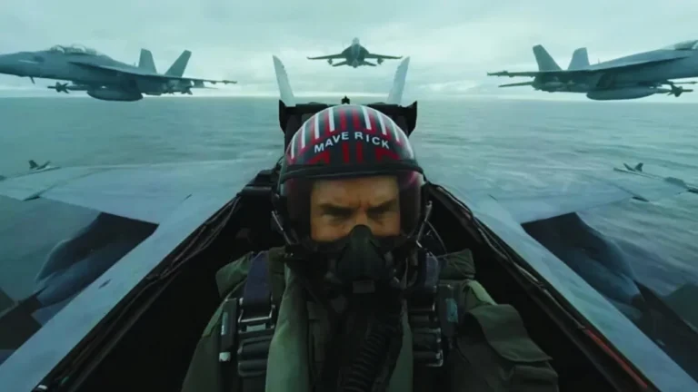 Tom Cruise as Maverick flying a fighter jet with squadron over the ocean in Top Gun 3 scene.