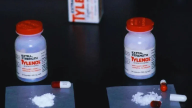 Two bottles of Extra Strength Tylenol with exposed capsules and white powder from the 1982 poisoning case.
