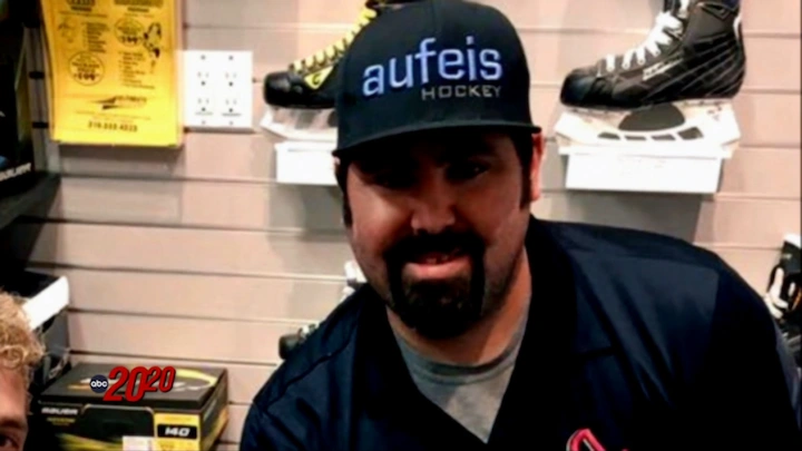 James Reyes wearing a black "Aufeis Hockey" cap inside a sports store.