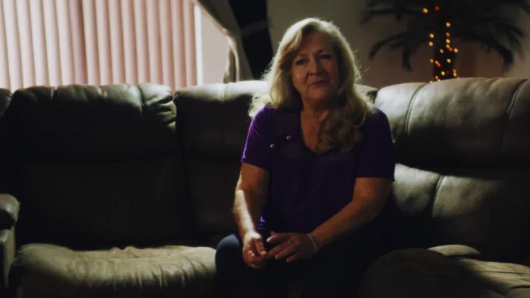 Barbara Hunt seated on couch, speaking about her life after ex-husband David Sconce’s crimes.