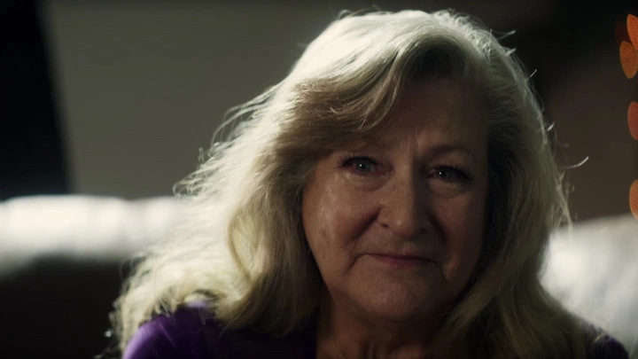 Barbara Hunt close-up portrait, calm and reflective during her interview in The Mortician documentary.
