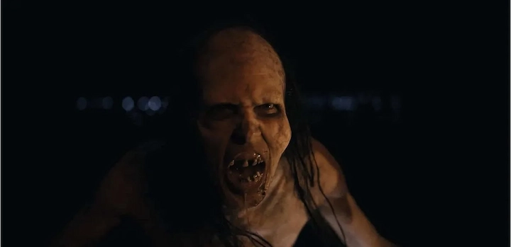 The Mother creature snarling in a terrifying scene from Barbarian movie.