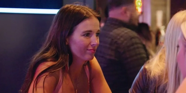Deanne Black chatting at a restaurant table with friends on TLC’s ‘Virgins’ date scene.