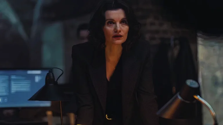 Emily Barber as Alice in MobLand, tense scene in dark office investigating Harrigan family.