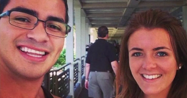 Photo of David Meza and Taylor Langston smiling together at an outdoor walkway location.
