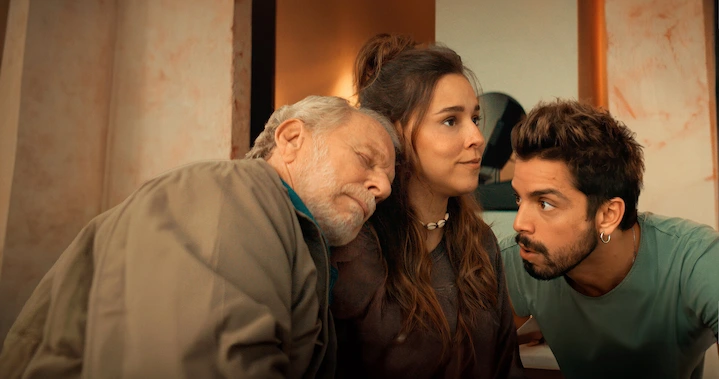 Jessica sits between Ben and Gabriel during an intimate, emotional moment in Cheers to Life.