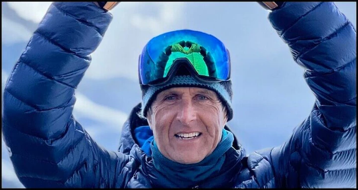 John Kircher smiling in ski gear with goggles, featured in John Kircher’s Net Worth 2025 article.