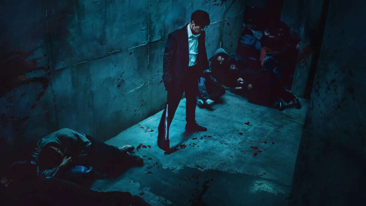 Mercy for None corridor scene featuring lead standing amid defeated enemies in a dimly lit tunnel.