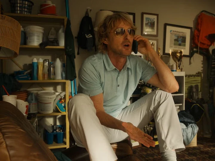 Owen Wilson as Pryce Cahill talking on phone in Apple TV+ golf comedy series Stick scene.