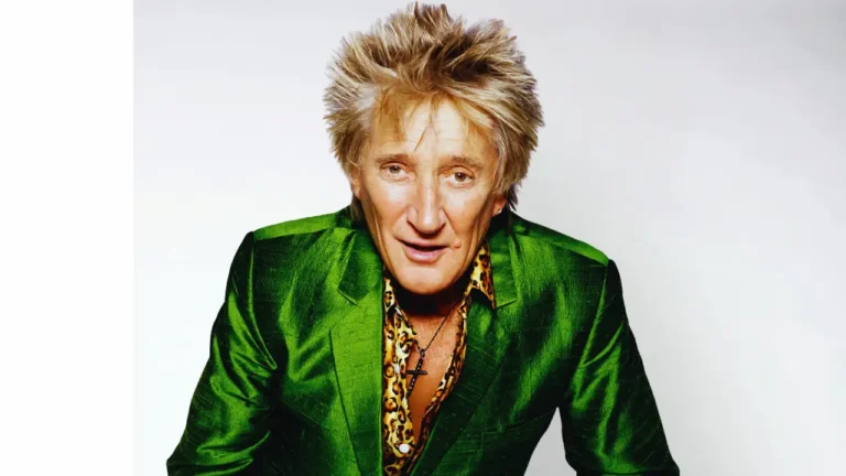 Portrait of Rod Stewart looking resilient in a green suit during his flu recovery announcement in June 2025.