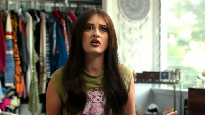 Sophie Fergi talking in her bedroom with open wardrobe in the background, casual outfit, long hair