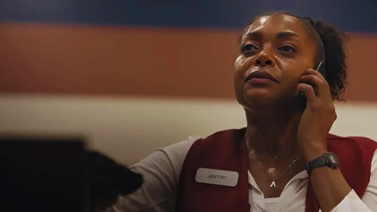 Taraji P. Henson as Janiyah sweating and speaking on the phone inside a bank lobby, close-up.